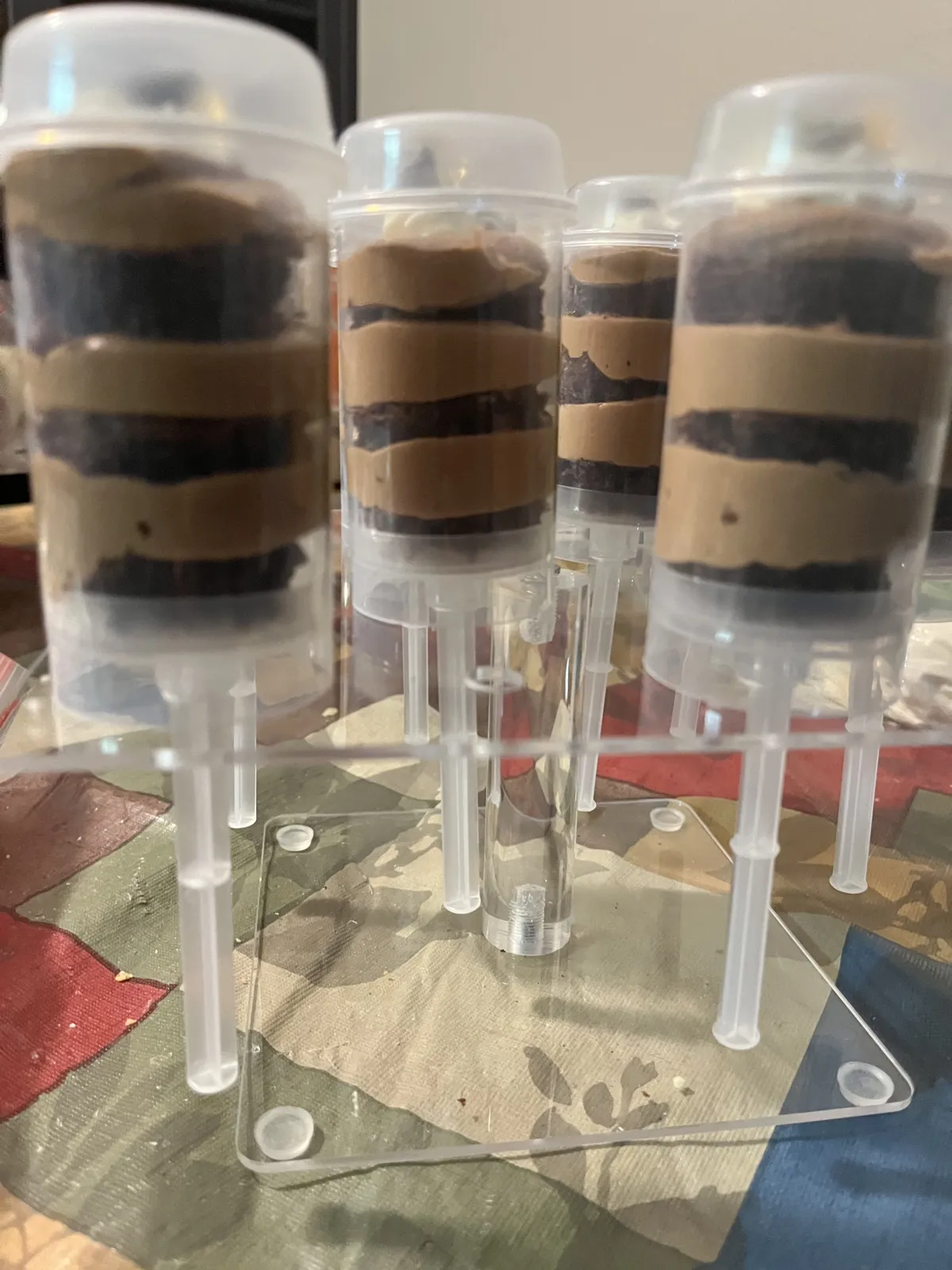 Push-up containers layered with cake and mousse
